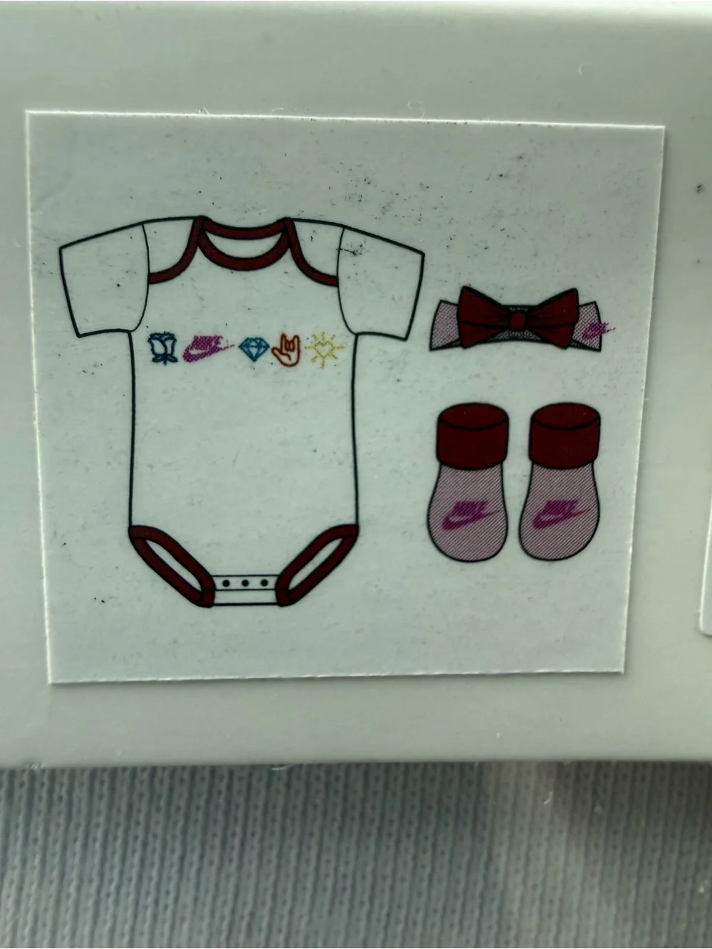 New girls Nike Baby 3-Piece Set in White and Red with Multicolor Icons